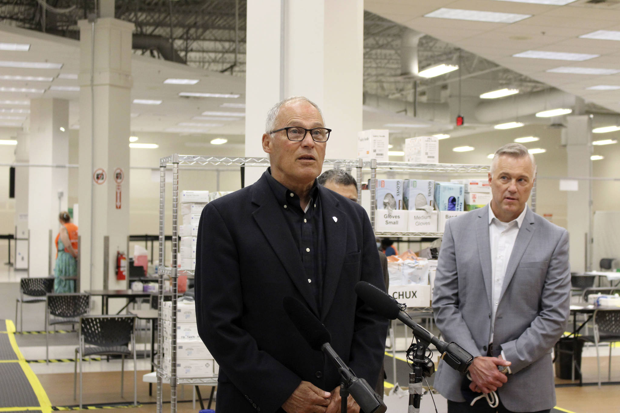 Gov. Jay Inslee (center) speaks about getting vaccinated during his visit to the Auburn vaccine clinic on June 22, 2021. Photo by Henry Stewart-Wood/Sound Publishing