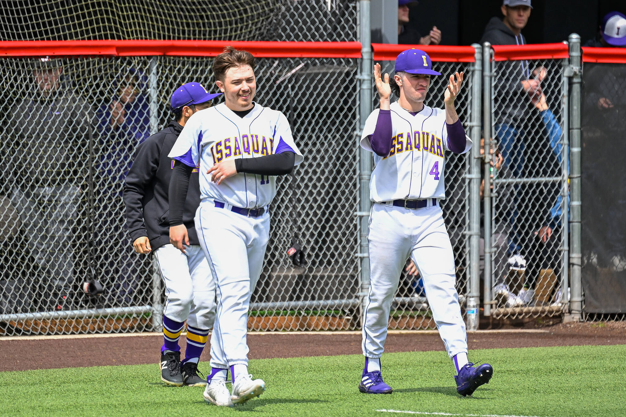 Joey Wilner (#11) and Dominic Guistino (#4) walk onto the field with smiles on May 7. Courtesy of Patrick Krohn.