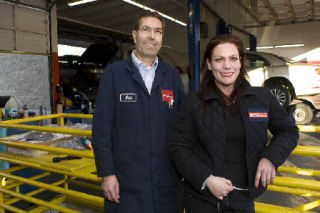 Mark Wagner and business manager Victoria Boulanger pose in Mark’s Japanese-European Auto’s new Issaquah location.