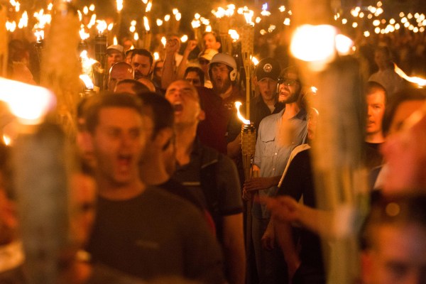 White nationalists and supremacists and neo Nazis carrying torches, surrounded and taunted counter protestors in Charlottesville.
