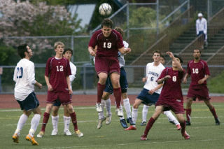 Eastlake senior Easton Fix goes up for a header Tuesday night at Juanita High School.