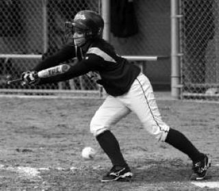 Issaquah’s Kristen Aratani lays down a bunt against Newport earlier this season. The Eagles beat the Knights four times before losing to them