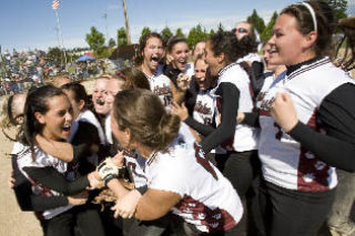 The Eastlake fastpitch team celebrates after defeating Shadle Park 4-1 Saturday for the state championship.